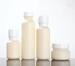 Skin-coloured goat milk suit glass bottle