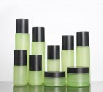 Green bottle with elegant black lid,Cosmetic glass empty bottles