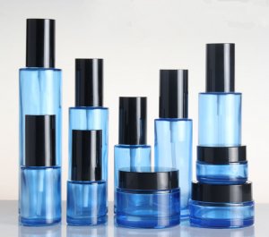 Bright black cover blue cosmetic spray bottle and press bottle